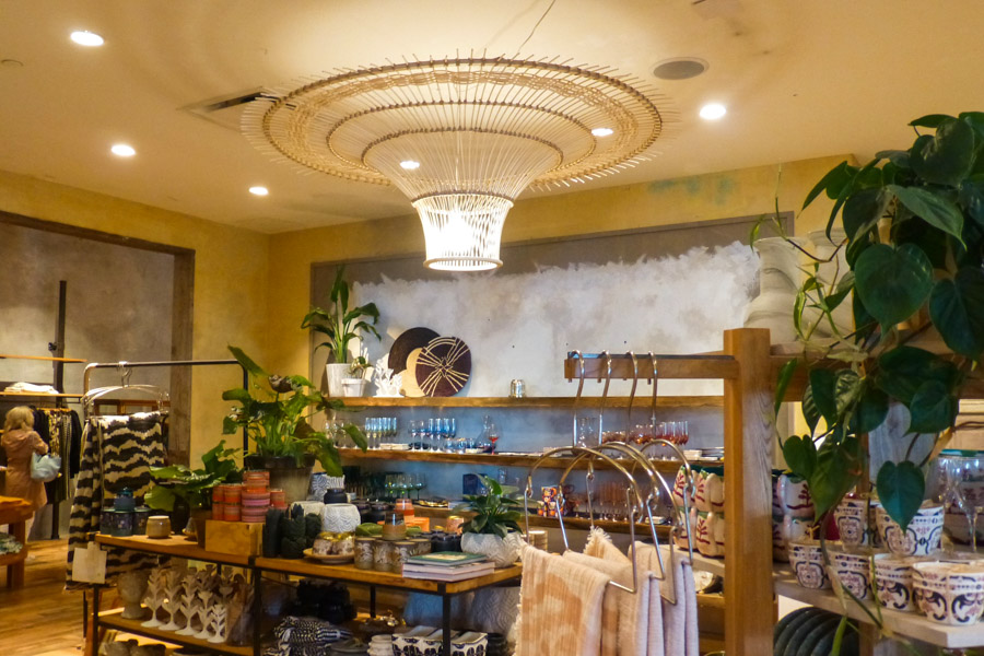 The interior lighting unit in Anthropologie; a wooden-like structure shaped like a funnel.