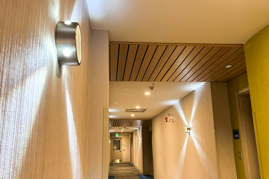 A close-up image of the circular wall lighting units placed in the Holiday Inn.